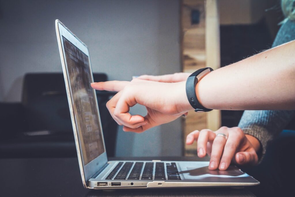 Blogger writing a guest post collaboration on laptop
