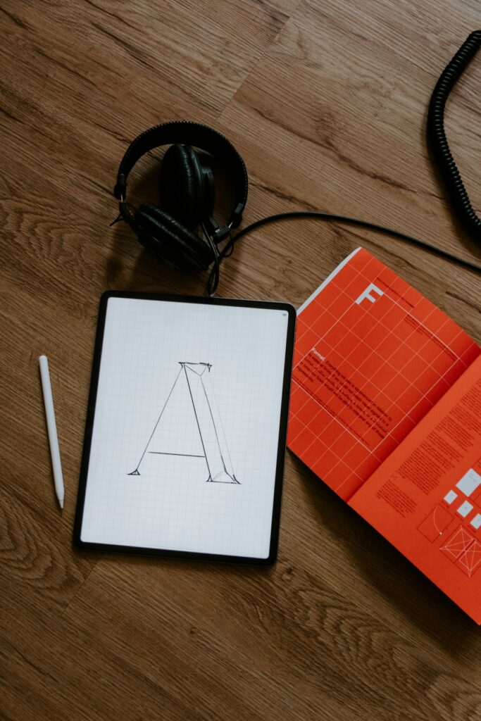 Social media content repurposing strategy for UK bloggers showing a smartphone, laptop and planning tools on a desk in 2026